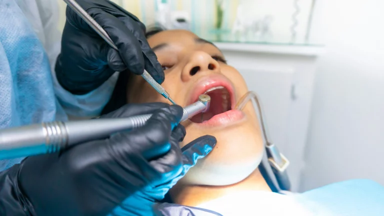 Girl having her teeth worked on in a dentist's chair.